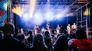 Dynamic band performing on stage at The Groove Lounge